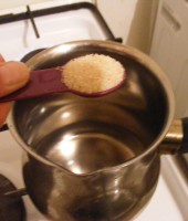 Dissolve the sugar into 1/2 cup lukewarm water