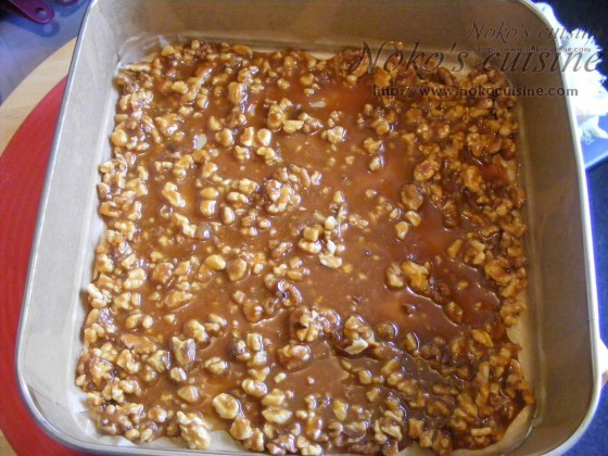 Spread the caramel topping into the baking tray