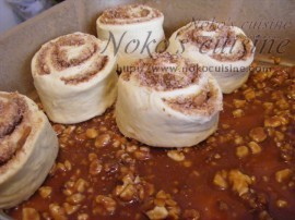 Place the rolls in the tray over the caramel topping