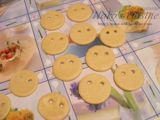 using a straw, make to little holes - the eyes of the cookies